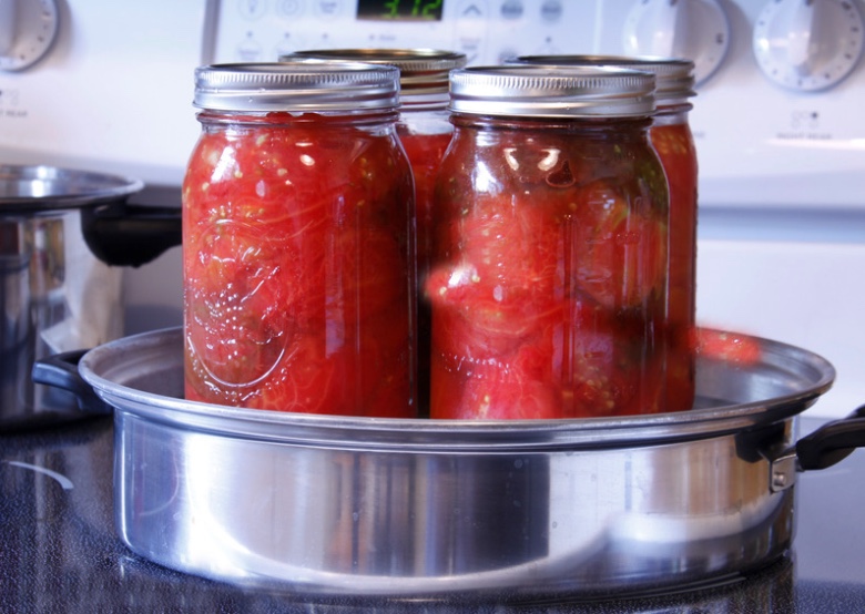 Tomatoes in canning jars.