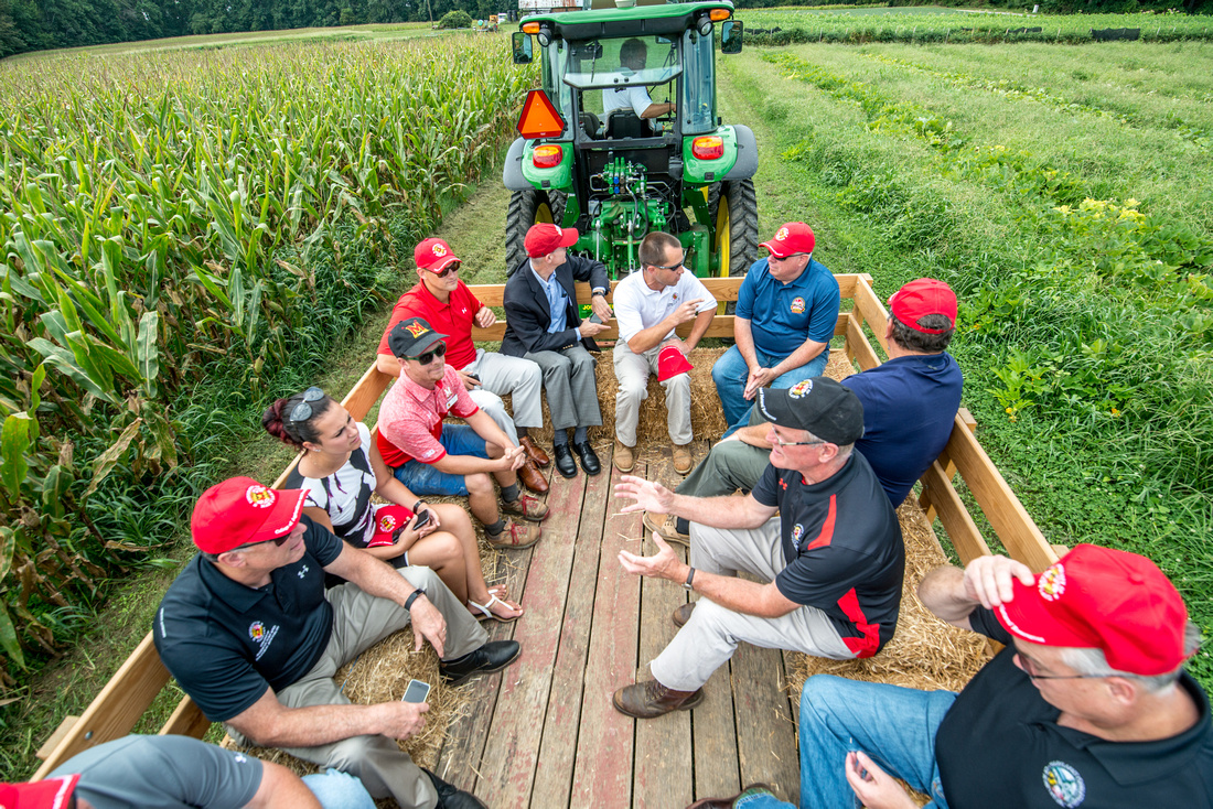 Farm tour at Terp Farm, people sitting on a tractor bed