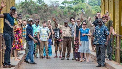 AGNR student trip in Liberia, smiling and waving at camera