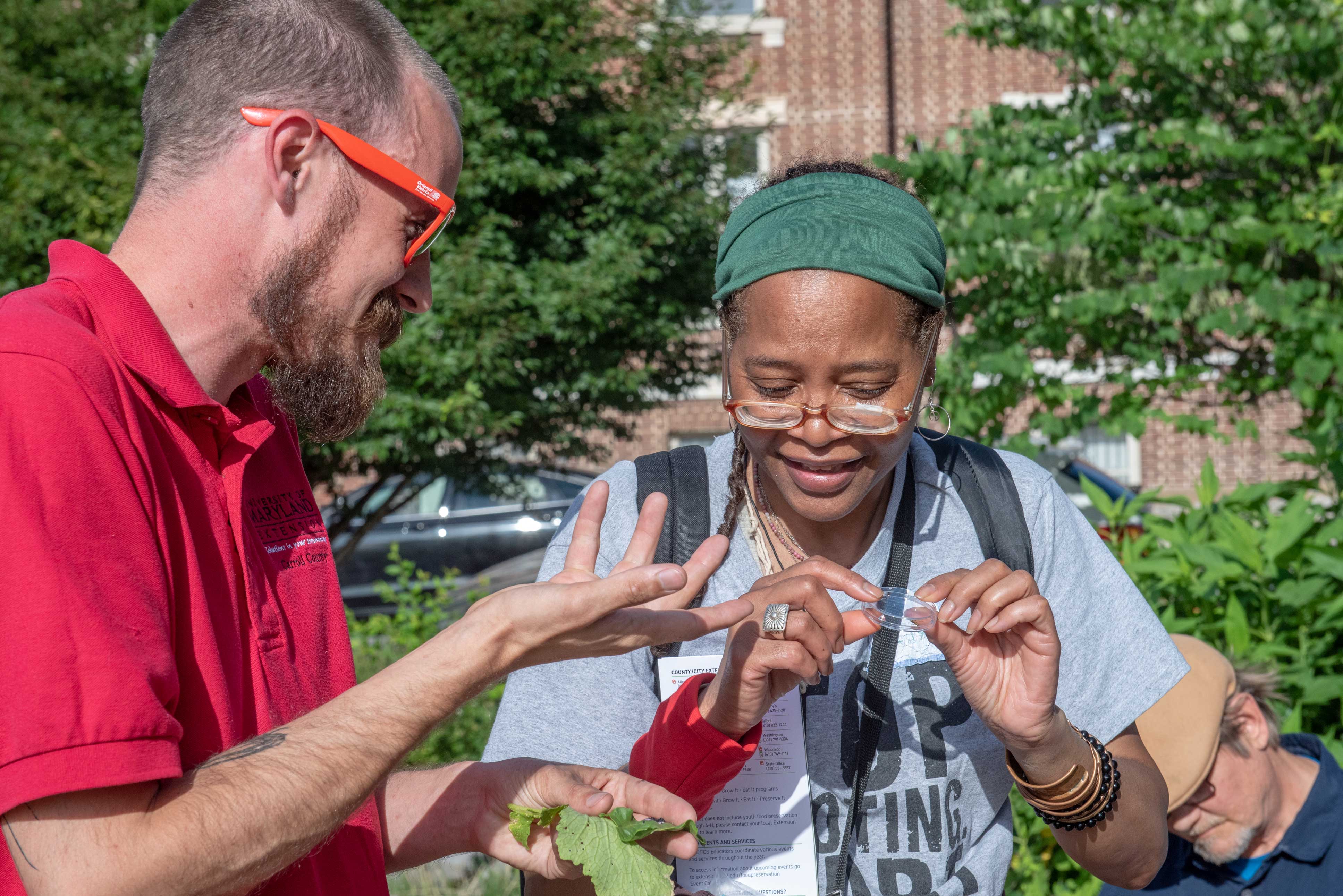 Photo of a staff member interacting with at an event attendee