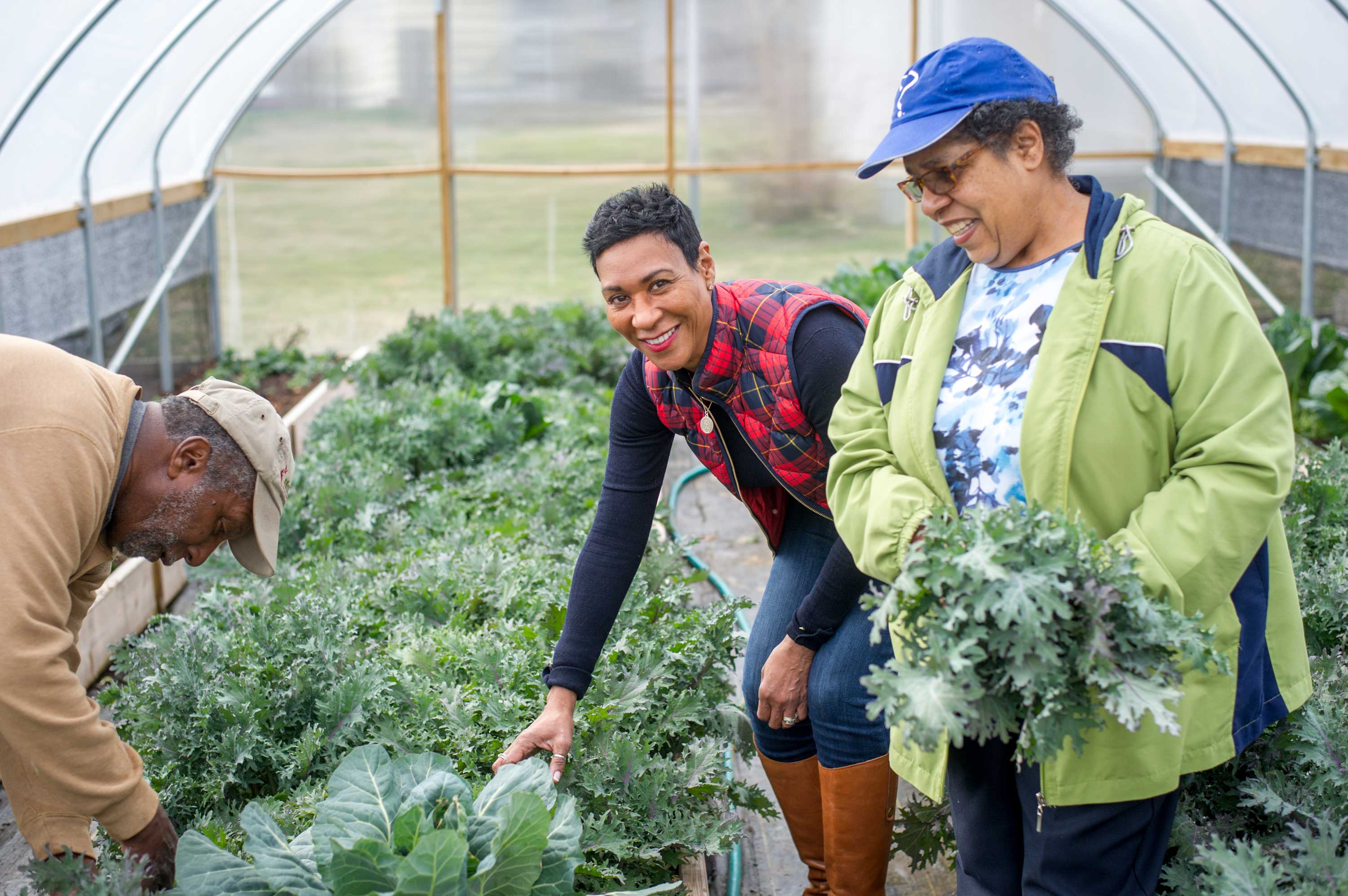 Two staff members at a garden