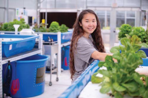 Student in the aquaponics lab