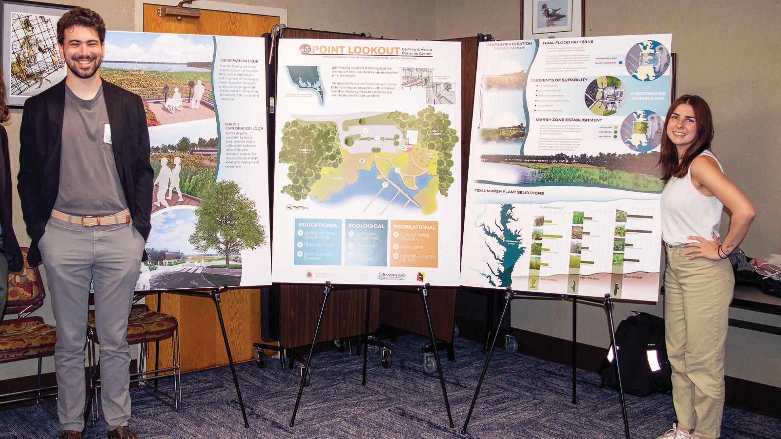 Two landscape architecture students standing at the LARC VR presentation at Maryland Department of Natural Resources.