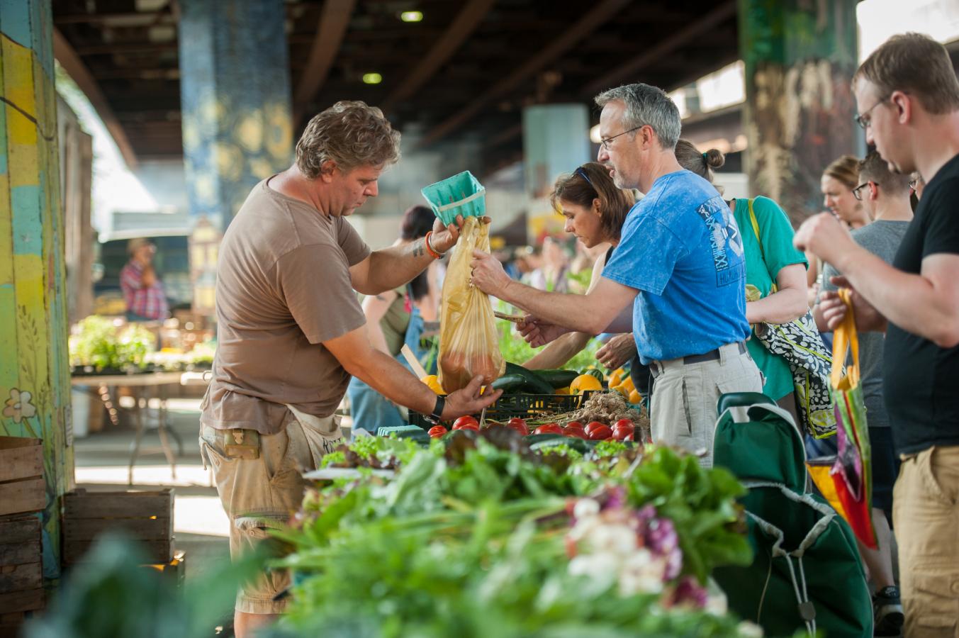 People shopping at a farmer's market