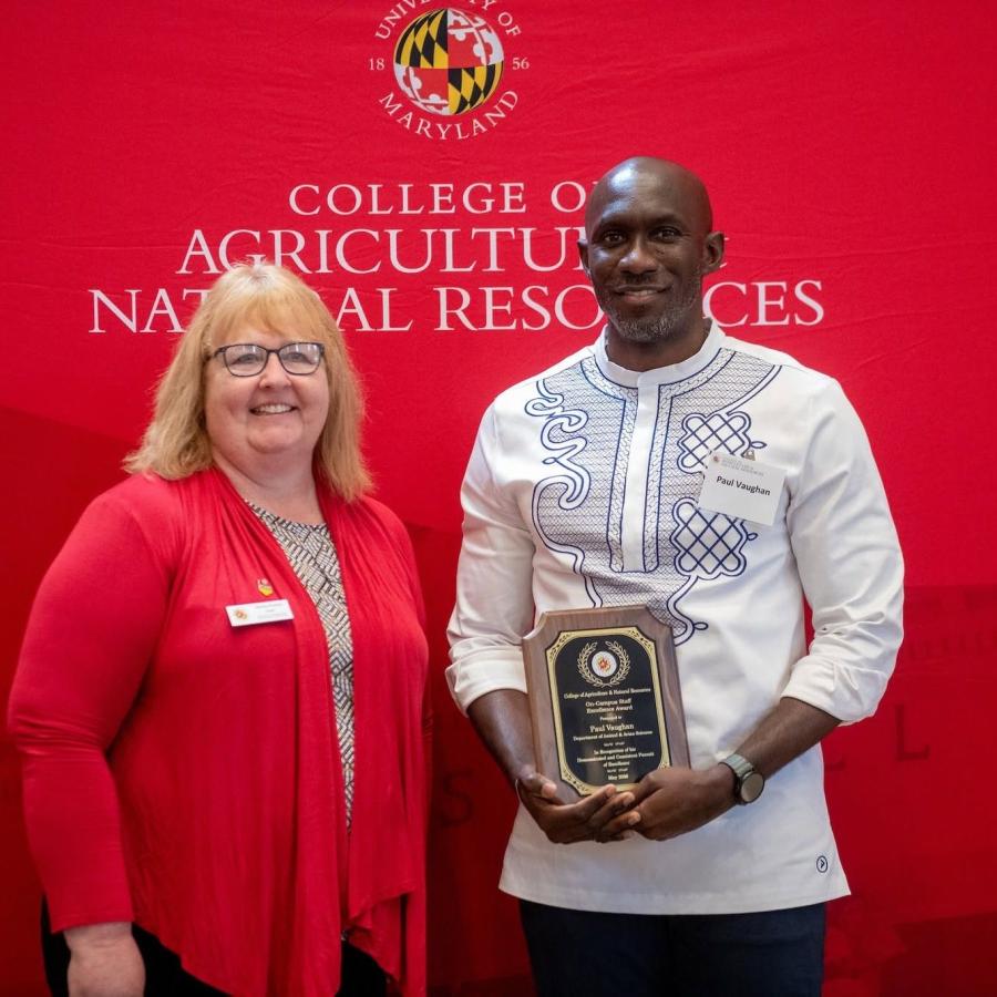 Dean Wendy Powers with AGNR staff member holding an award
