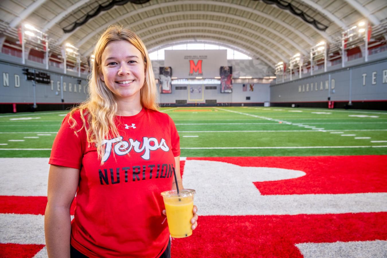 Nutrition student at the football practice facility